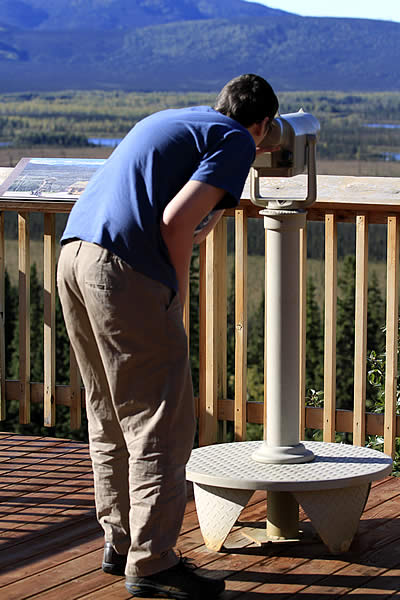 Mike Jameson looks for wildlife from the deck ar the Tetlin Refuge Visitor Center located at Mile 1229 of the Alaska Highway.